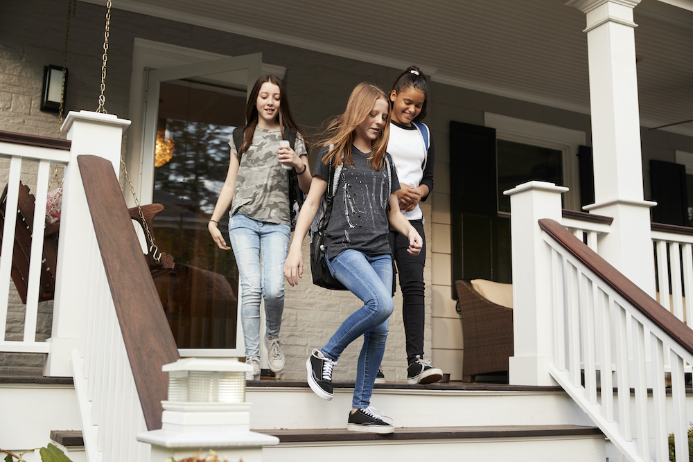 Teen girls walking down steps